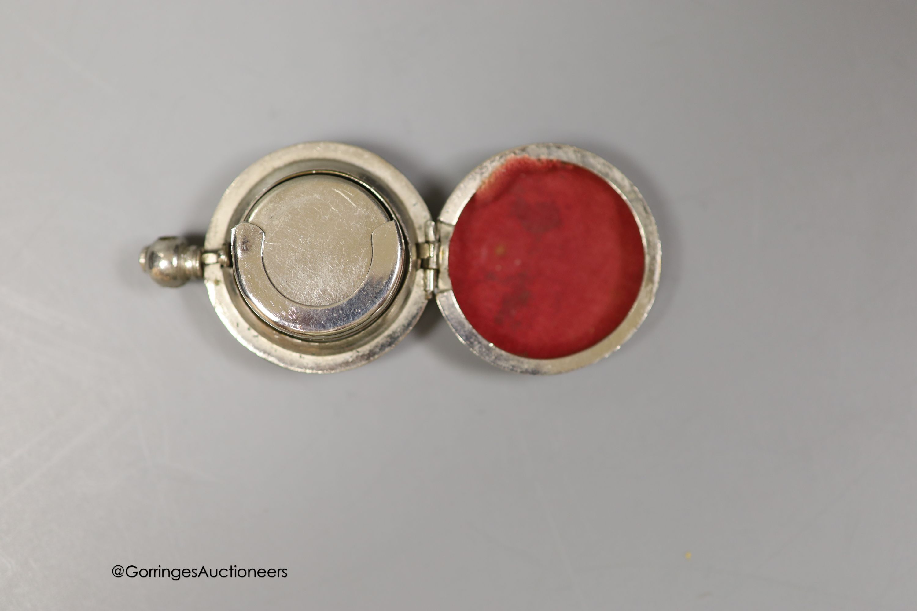 A 19th century Dutch white metal pill box, 42mm and a base metal sovereign case.